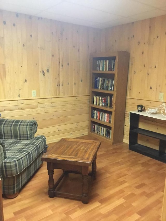N9960 Meadowlark Ln, Crivitz, WI 54114 - sitting room featuring wooden walls and light wood-style flooring