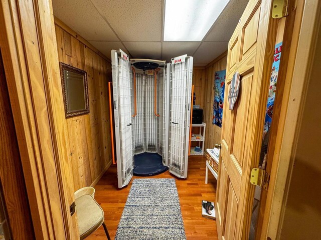 N9960 Meadowlark Ln, Crivitz, WI 54114 - hallway with wooden walls, light wood finished floors, and a drop ceiling