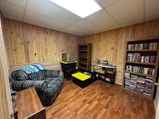 N9960 Meadowlark Ln, Crivitz, WI 54114 - living area featuring wood walls, a paneled ceiling, and wood finished floors
