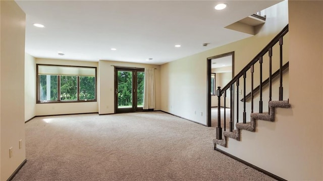 2504 E Princeton Ave, Eau Claire, WI 54703 - carpeted empty room featuring recessed lighting, stairs, and baseboards