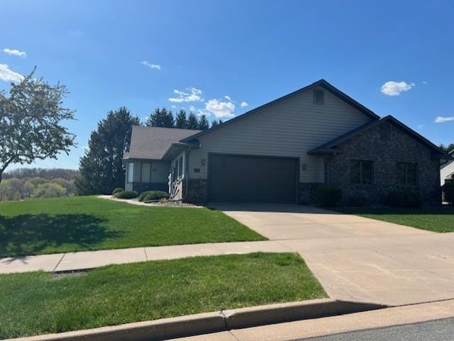 2504 E Princeton Ave, Eau Claire, WI 54703 - ranch-style home with an attached garage, driveway, a front lawn, and stone siding
