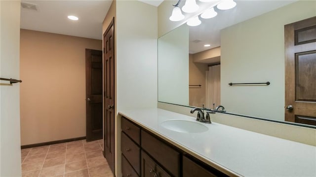 2504 E Princeton Ave, Eau Claire, WI 54703 - bathroom featuring vanity, recessed lighting, baseboards, and tile patterned floors