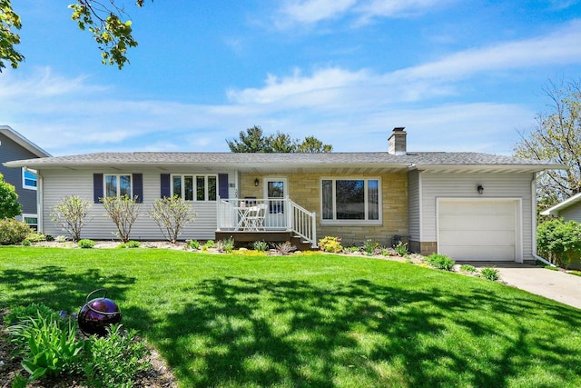 308 Maple Dr, Mount Horeb, WI 53572 - ranch-style house with an attached garage, a chimney, a front yard, and stone siding