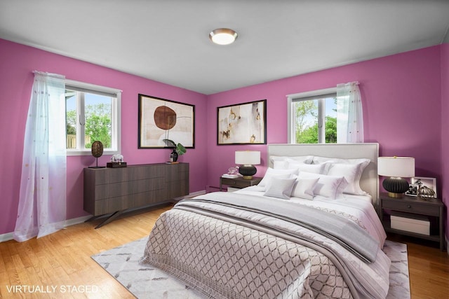 308 Maple Dr, Mount Horeb, WI 53572 - bedroom with light wood-style flooring and baseboards