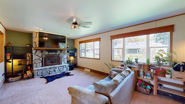602 W Carol St, Colby, WI 54421 - carpeted living area with ceiling fan, a fireplace, and baseboards