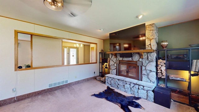602 W Carol St, Colby, WI 54421 - carpeted living room with a stone fireplace, a chandelier, and baseboards
