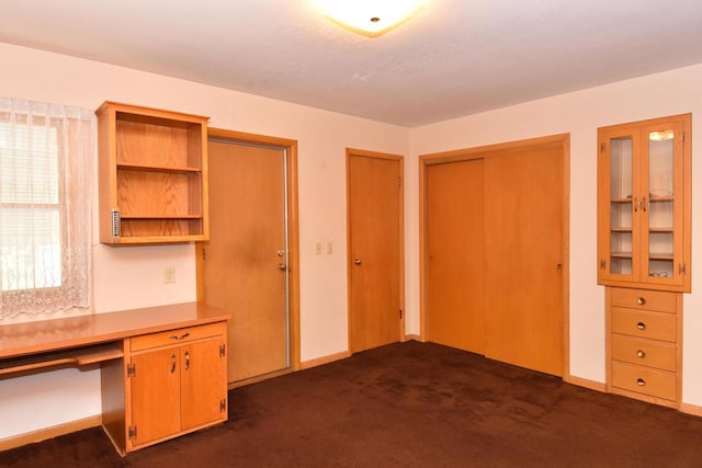 15060 Carpenter Rd, Brookfield, WI 53005 - unfurnished office with dark carpet, built in study area, and baseboards