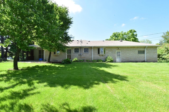15060 Carpenter Rd, Brookfield, WI 53005 - rear view of property featuring a yard and stone siding