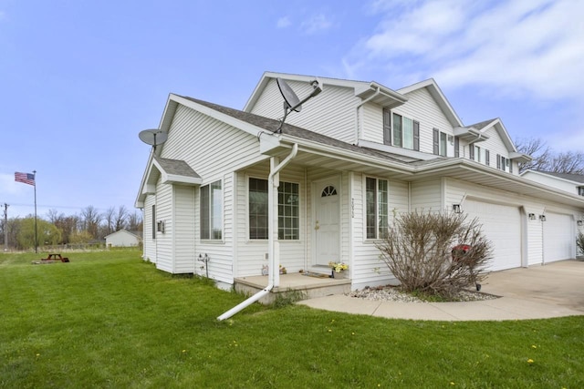 2020 Autumn Ln, Kaukauna, WI 54130 - view of front of property with concrete driveway, a front lawn, and a garage