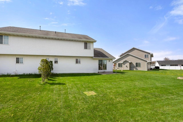 2020 Autumn Ln, Kaukauna, WI 54130 - rear view of property with a yard