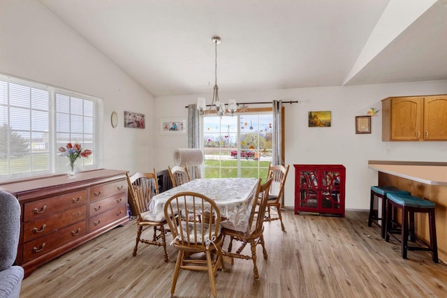 2020 Autumn Ln, Kaukauna, WI 54130 - dining space featuring vaulted ceiling, a chandelier, and light wood finished floors