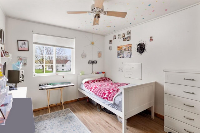 2020 Autumn Ln, Kaukauna, WI 54130 - bedroom featuring wood finished floors, a ceiling fan, and baseboards