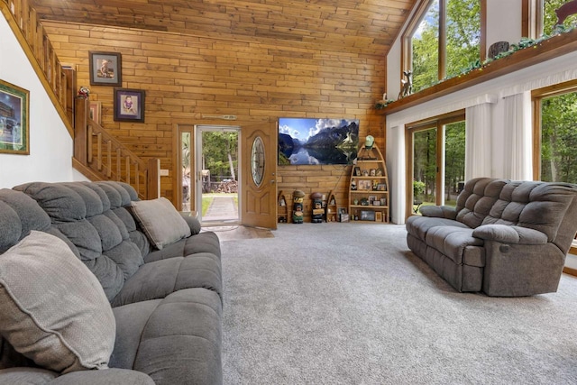 9232 W Lake Dr, Pound, WI 54161 - living room with wooden walls, high vaulted ceiling, carpet flooring, stairs, and wooden ceiling