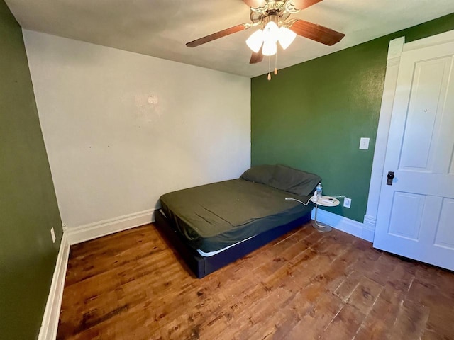 108 S Center St, Orfordville, WI 53576 - bedroom featuring wood finished floors, baseboards, and a ceiling fan