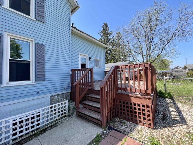 108 S Center St, Orfordville, WI 53576 - wooden terrace featuring fence