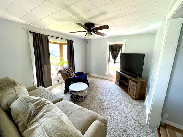 108 S Center St, Orfordville, WI 53576 - carpeted living area featuring ceiling fan and baseboards
