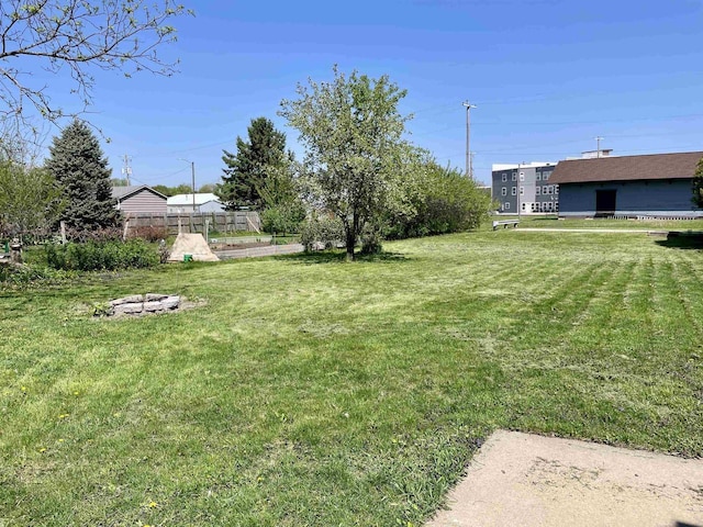 108 S Center St, Orfordville, WI 53576 - view of green lawn with an outdoor fire pit