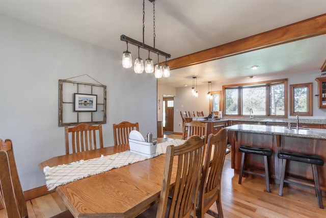 N4618 State Road 49, Waupaca, WI 54981 - dining area with light wood finished floors, baseboards, and beam ceiling