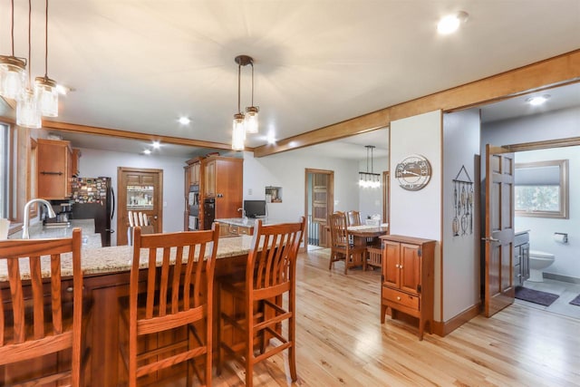 N4618 State Road 49, Waupaca, WI 54981 - dining room with light wood-type flooring, recessed lighting, and baseboards