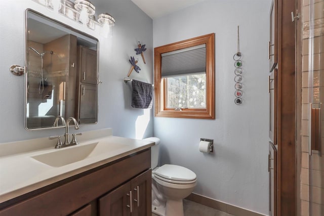 N4618 State Road 49, Waupaca, WI 54981 - bathroom featuring a shower, toilet, vanity, and baseboards