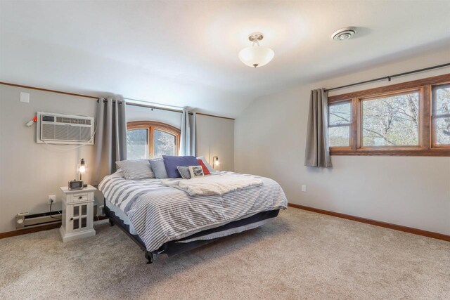 N4618 State Road 49, Waupaca, WI 54981 - bedroom featuring a baseboard radiator, a wall mounted air conditioner, multiple windows, light carpet, and lofted ceiling