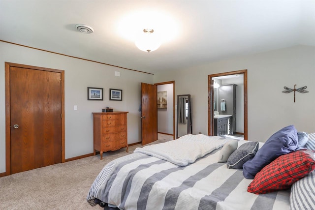 N4618 State Road 49, Waupaca, WI 54981 - bedroom with light carpet, ensuite bath, and baseboards