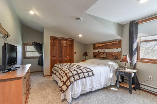 N4618 State Road 49, Waupaca, WI 54981 - bedroom with lofted ceiling, light colored carpet, baseboard heating, a closet, and baseboards