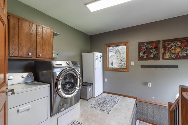 N4618 State Road 49, Waupaca, WI 54981 - laundry area with washer and clothes dryer and cabinet space