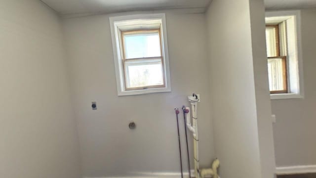 washroom featuring electric dryer hookup and baseboards
