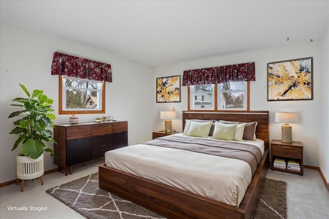 1408 S Hemlock Ave, Marshfield, WI 54449 - bedroom featuring light colored carpet, multiple windows, and baseboards