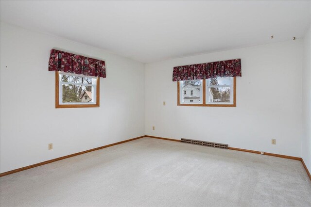 1408 S Hemlock Ave, Marshfield, WI 54449 - empty room featuring healthy amount of natural light, carpet, and baseboards