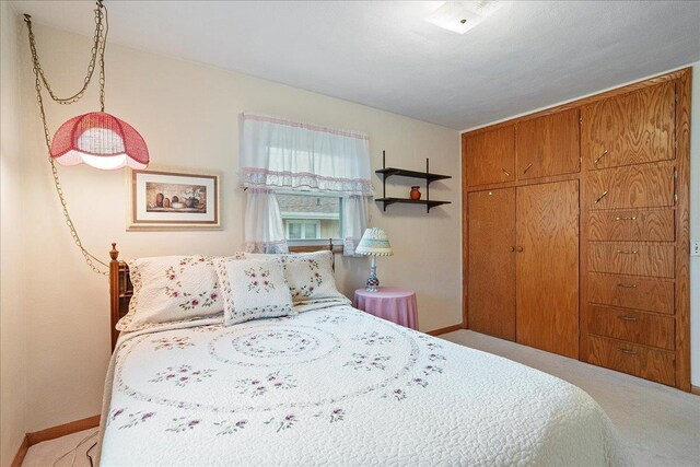 1408 S Hemlock Ave, Marshfield, WI 54449 - bedroom featuring baseboards and light carpet