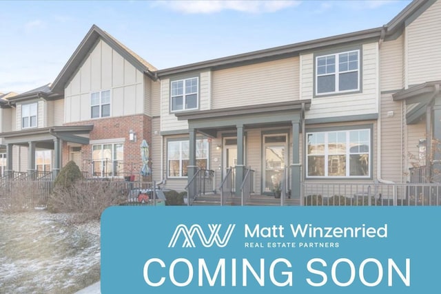 1119 Enterprise Dr, Verona, WI 53593 - rear view of house featuring board and batten siding and brick siding