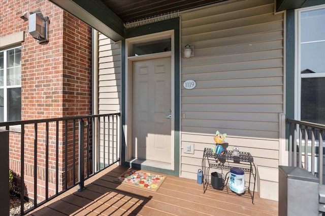 1119 Enterprise Dr, Verona, WI 53593 - doorway to property featuring brick siding and a wall unit AC