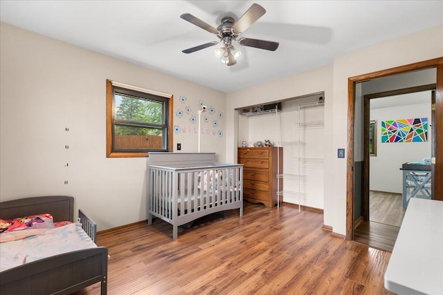 1528 Jefferson St, West Bend, WI 53090 - bedroom with light wood finished floors, baseboards, and a ceiling fan