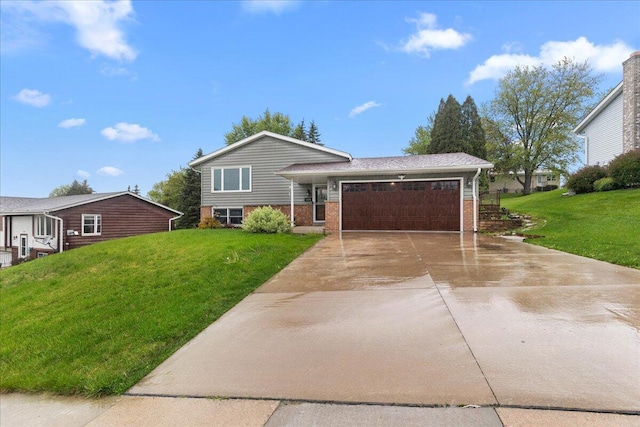 1528 Jefferson St, West Bend, WI 53090 - split level home with a garage, concrete driveway, a front lawn, and brick siding