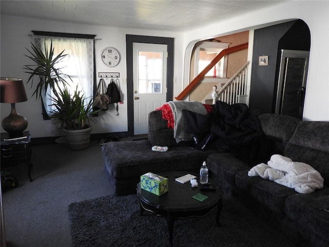 818 W Main St, Augusta, WI 54722 - carpeted living room featuring stairway and arched walkways