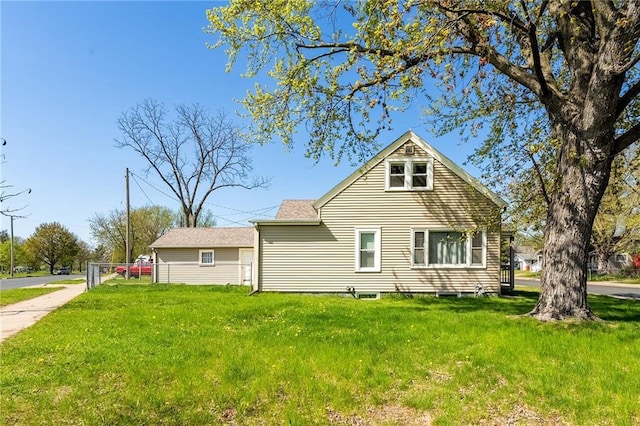 rear view of property with a yard