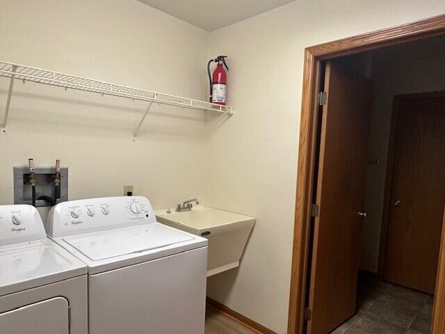 1521 Raveen St, Fort Atkinson, WI 53538 - washroom with independent washer and dryer and baseboards
