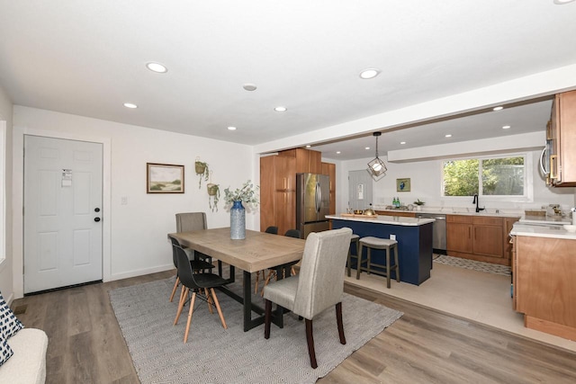 7113 N Navajo Ave, Glendale, WI 53217 - dining space featuring light wood finished floors and recessed lighting