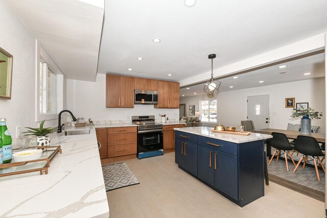 7113 N Navajo Ave, Glendale, WI 53217 - kitchen featuring stainless steel appliances, a sink, recessed lighting, light stone counters, and hanging light fixtures