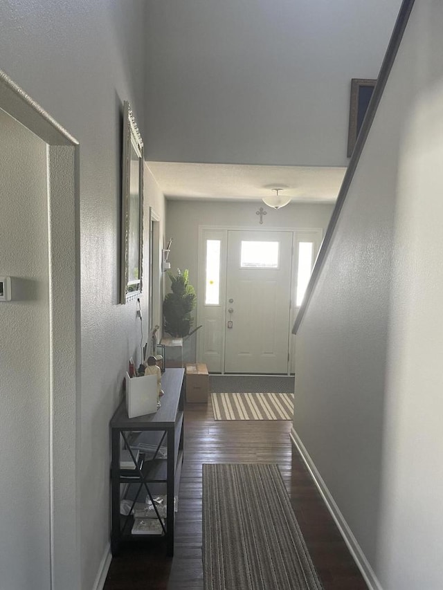 425 Champlain Dr, Johnson Creek, WI 53038 - entryway featuring dark wood-style flooring and baseboards