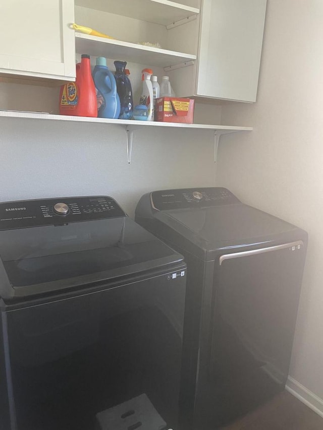425 Champlain Dr, Johnson Creek, WI 53038 - laundry room with cabinet space, washing machine and clothes dryer, and baseboards