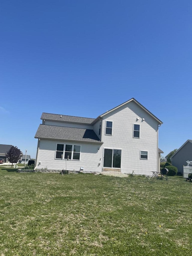 425 Champlain Dr, Johnson Creek, WI 53038 - back of property with a yard and a shingled roof