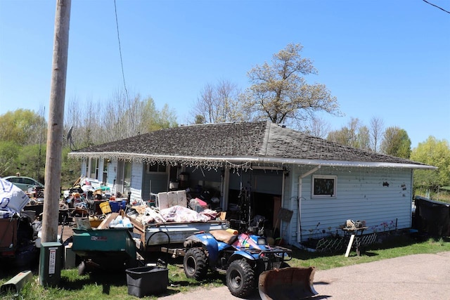 W5318 Hillside Dr, Merrill, WI 54452 - rear view of house with roof with shingles and a garage