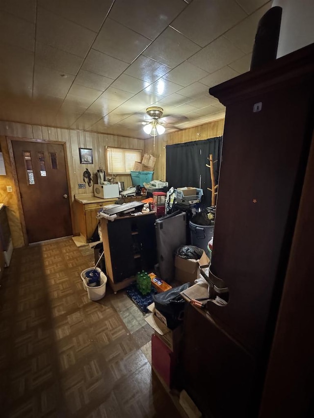 W5318 Hillside Dr, Merrill, WI 54452 - interior space with wooden walls, ceiling fan, light countertops, and white microwave
