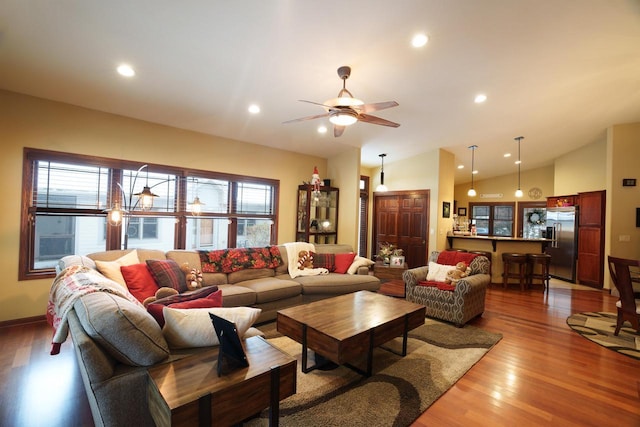 1839 Trevino Trl Unit 6, Mount Pleasant, WI 53405 - living area featuring plenty of natural light, wood finished floors, ceiling fan, recessed lighting, and vaulted ceiling