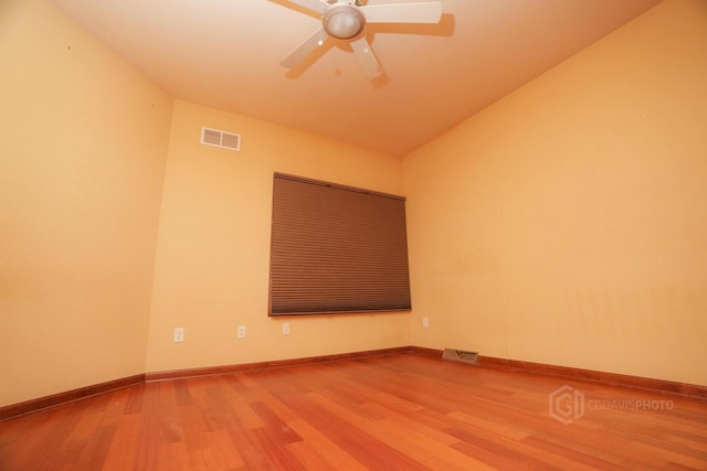 1839 Trevino Trl Unit 6, Mount Pleasant, WI 53405 - spare room with wood finished floors, ceiling fan, baseboards, and lofted ceiling
