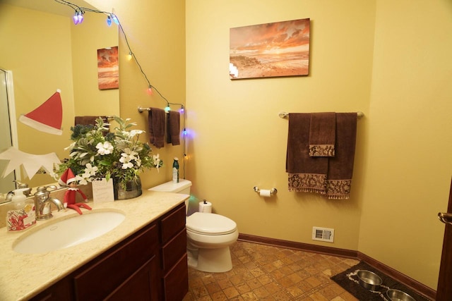 1839 Trevino Trl Unit 6, Mount Pleasant, WI 53405 - bathroom with vanity, toilet, baseboards, and tile patterned floors