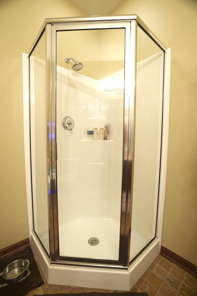1839 Trevino Trl Unit 6, Mount Pleasant, WI 53405 - bathroom featuring a stall shower and baseboards
